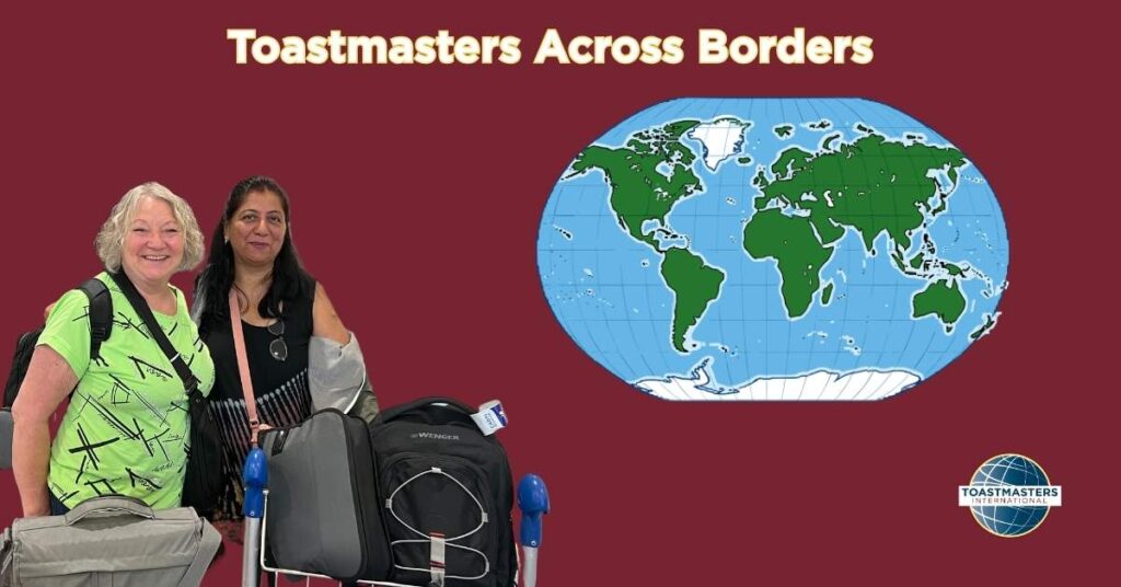 Two women travelers with luggage stand smiling beside a world map graphic under the title “Toastmasters Across Borders,” representing global connection through Toastmasters.